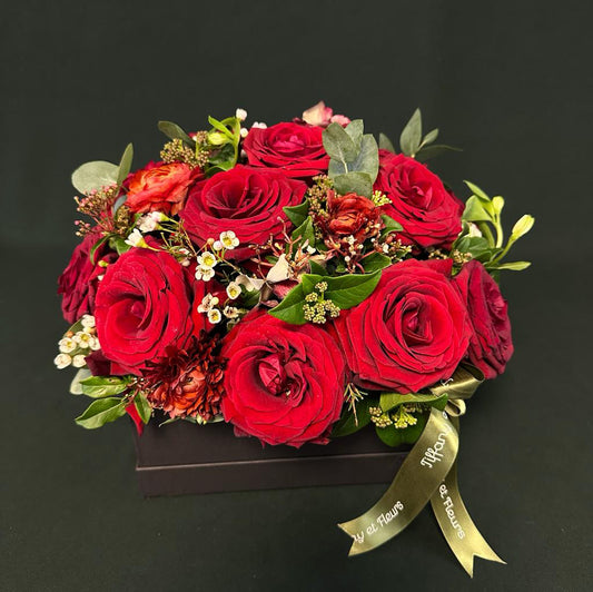 Valentine's Day deep red rose box with rich, velvety roses and complementary greenery, symbolizing deep love and desire.